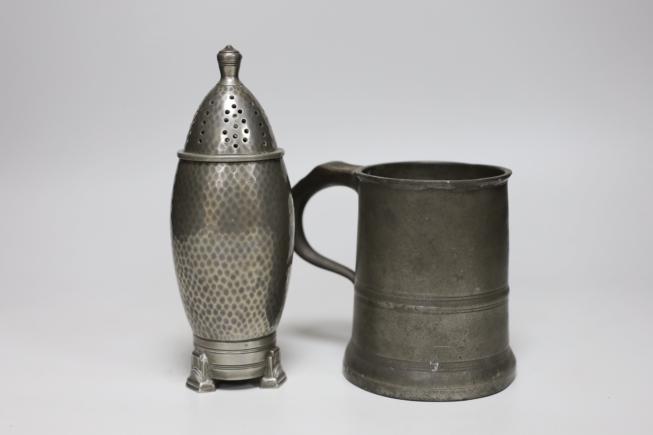A Frank Cobb & Co pewter sugar castor- 19cms high and a pewter mug